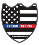 Behind the Tin